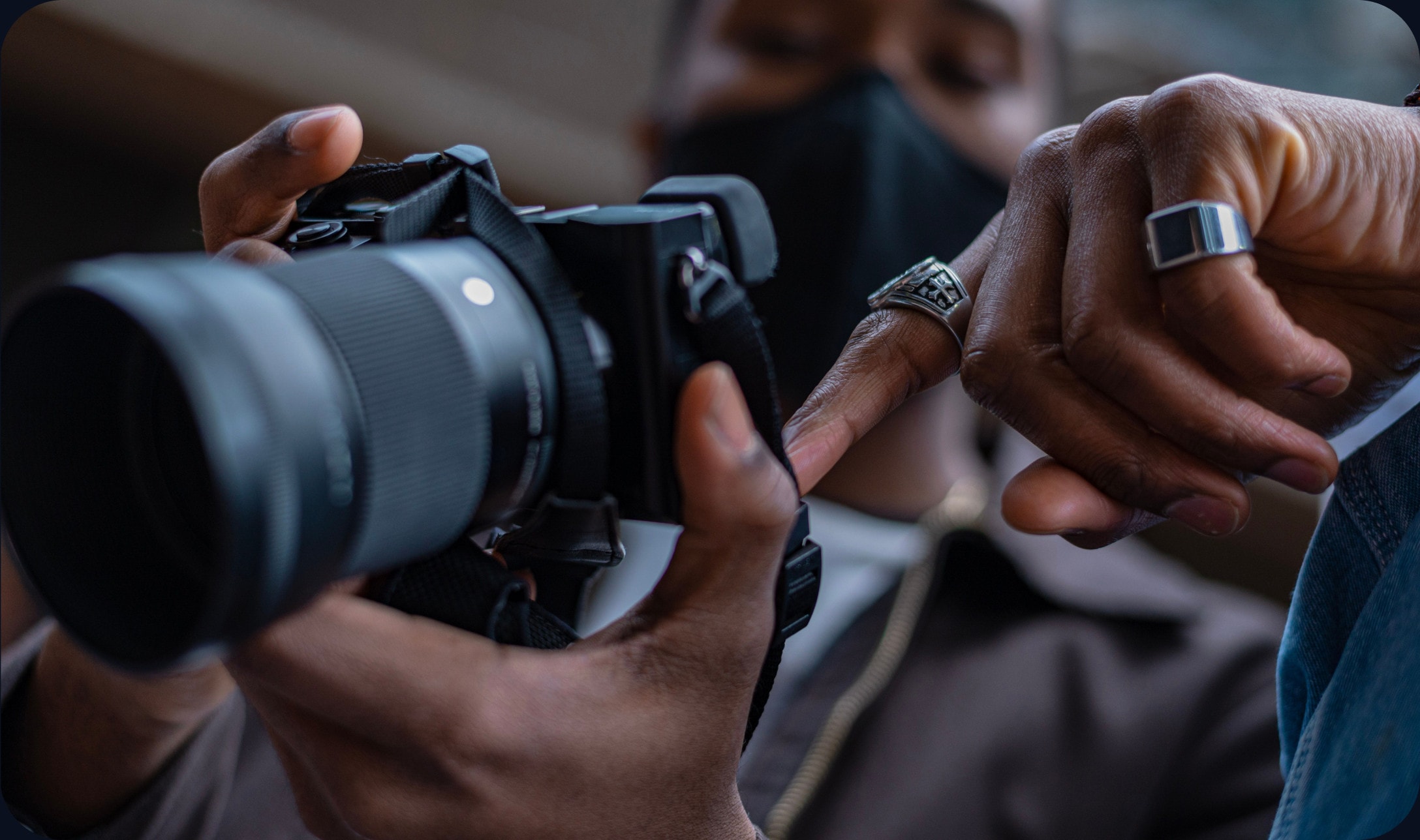 A photographer reviewing shots on a laptop